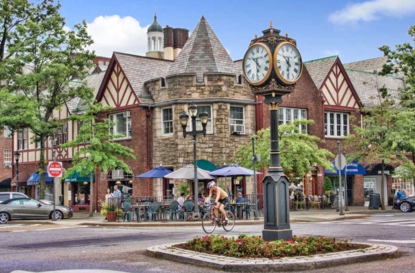 A Hiep Sanitation dumpster on a lush residential street in Scarsdale, NY, providing efficient and discreet waste removal services.