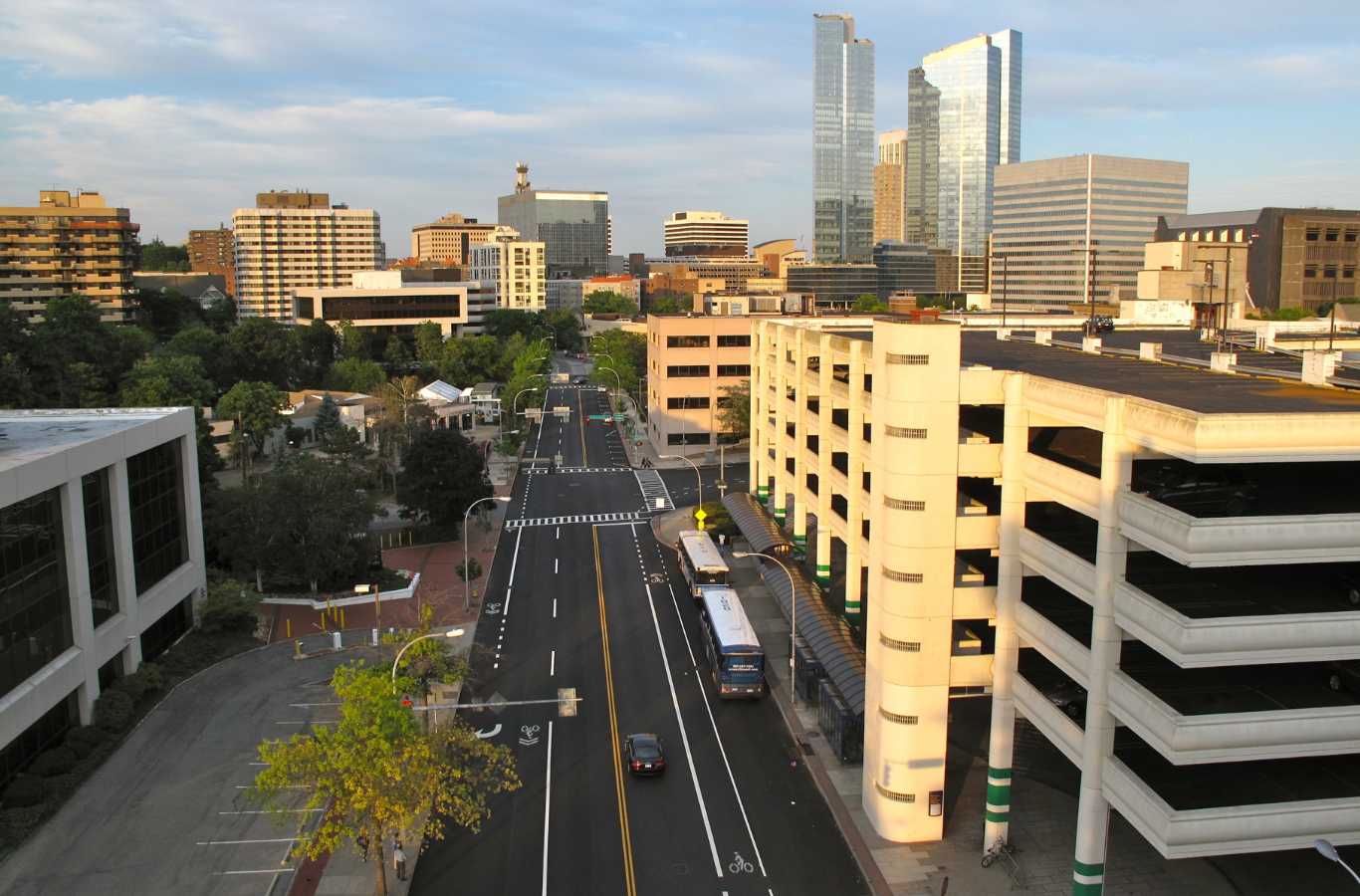 Hiep Sanitation dumpster positioned at a commercial building site in White Plains, NY, highlighting effective and professional waste disposal services.