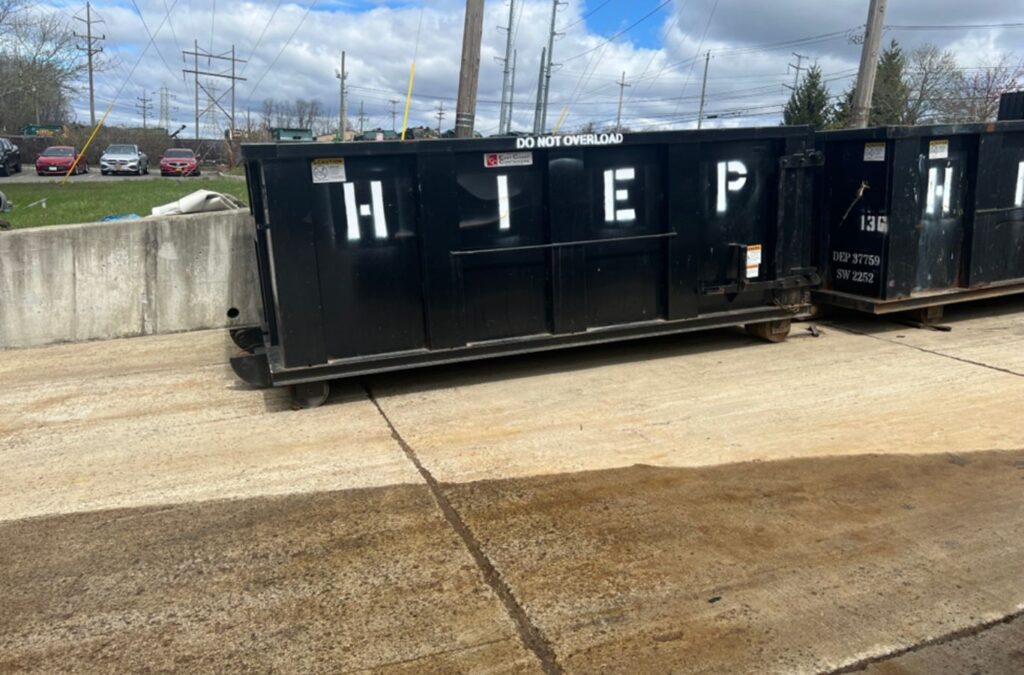 A Hiep Sanitation dumpster at a residential property in Nyack, NY, showing efficient waste management services.