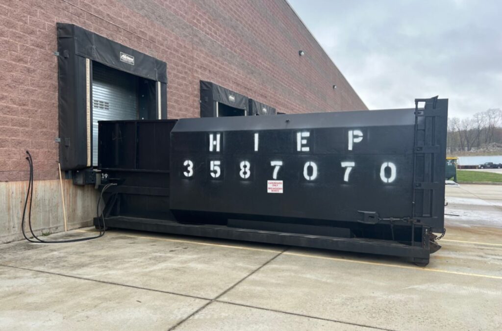 A Hiep Sanitation worker handling commercial trash in Clarkstown, NY, highlighting eco-friendly disposal and dependable solutions.